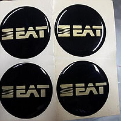 Наклейки на колпаки, диам. 90 мм "SEAT" черные (4 шт) (D)